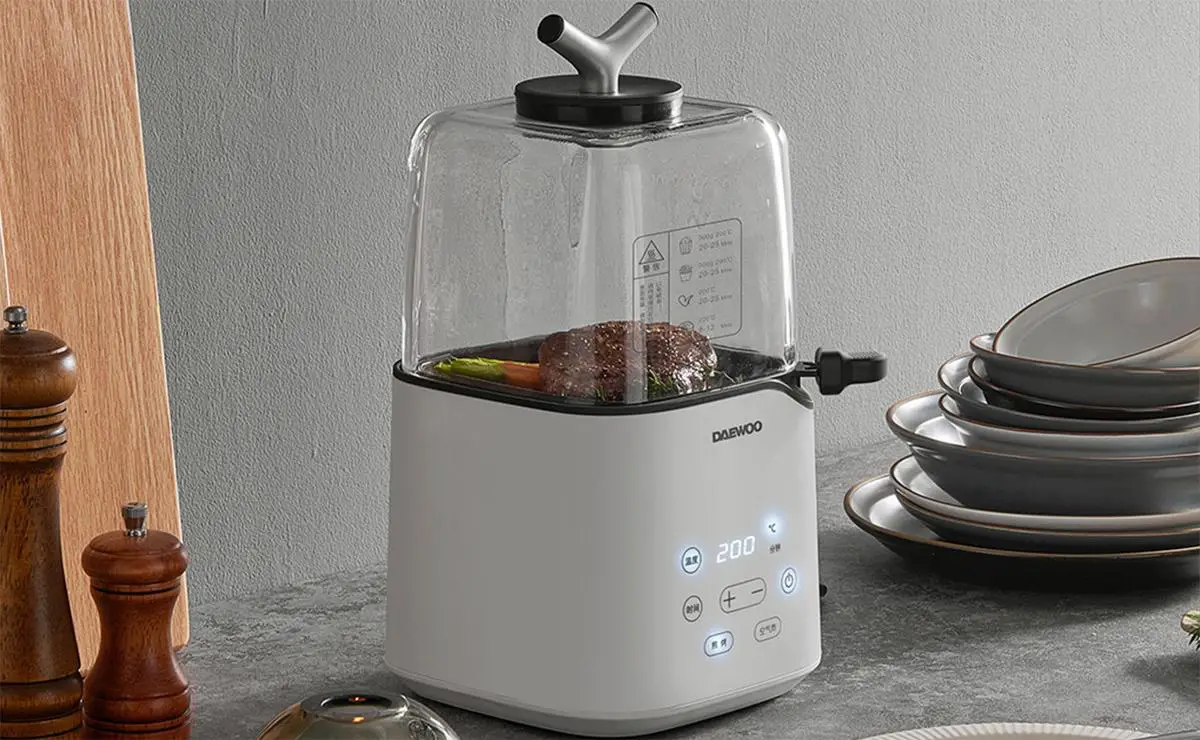 A compact air fryer cooking crispy chicken