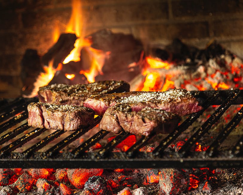 A compact grill with various food items being grilled on it